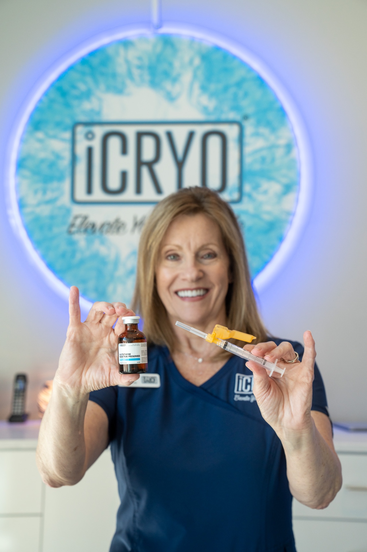 iCRYO Avon registered nurse holding glutathione IM shot vial and syringe